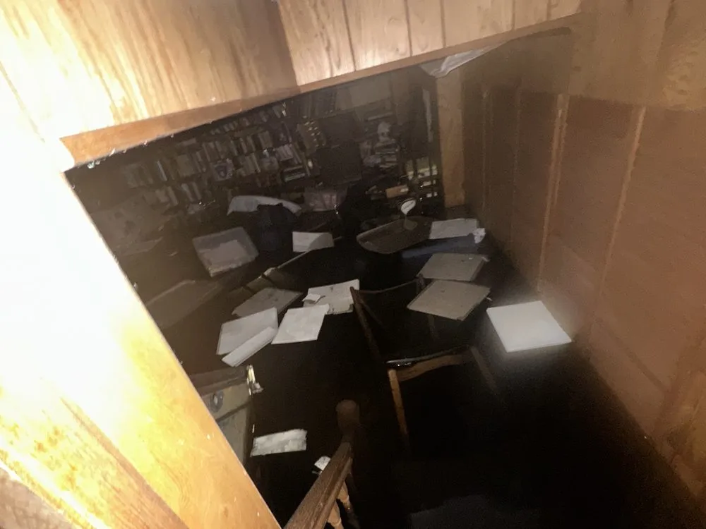 Emergency water damage restoration service in Long Island, NY — flooded room with drying equipment